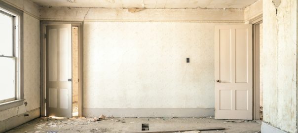 gray concrete walls with broken floor