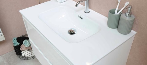 white ceramic sink with stainless steel faucet