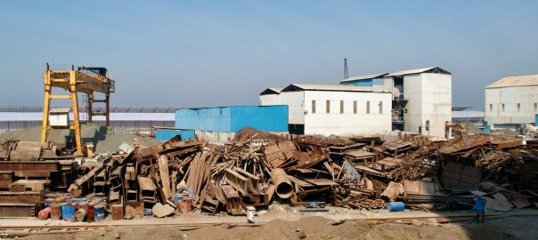 a pile of junk sitting in front of a building