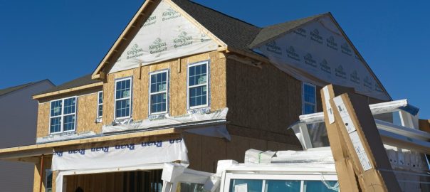 a house under construction with the roof ripped off