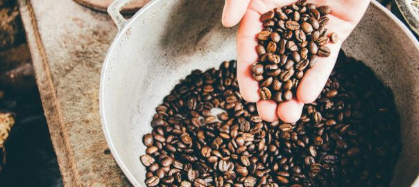 coffee beans on gray steel wok