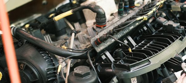 the engine compartment of a car with the hood open