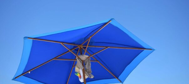 blue and brown patio umbrella during daytime
