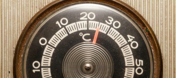 a close up of a thermometer on a wall
